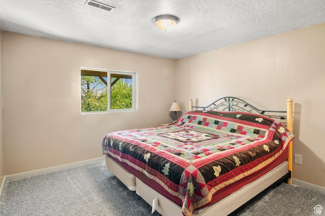 1235 Lakeview Dr, Garden City, UT 84028 - carpeted bedroom with baseboards and a textured ceiling