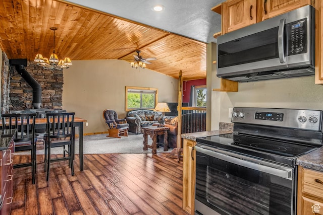 1235 Lakeview Dr, Garden City, UT 84028 - kitchen with appliances with stainless steel finishes, a wood stove, lofted ceiling, wood ceiling, and a chandelier