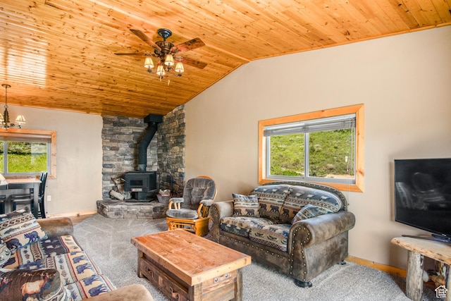 1235 Lakeview Dr, Garden City, UT 84028 - living room featuring a wood stove, wood ceiling, a ceiling fan, vaulted ceiling, and baseboards