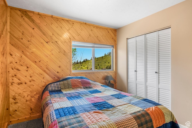 1235 Lakeview Dr, Garden City, UT 84028 - bedroom featuring wood walls and a closet
