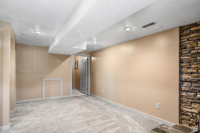 1235 Lakeview Dr, Garden City, UT 84028 - finished below grade area featuring a textured ceiling, baseboards, carpet, and recessed lighting