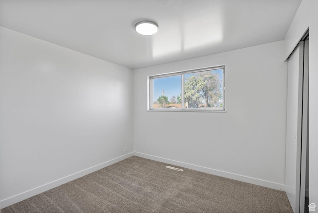 672 Nelson Ave, Tooele, UT 84074 - unfurnished bedroom featuring carpet, baseboards, and a closet