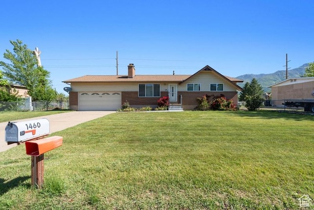 1460 Canyon Dr, South Weber, UT 84405 - ranch-style house with a garage, a chimney, driveway, and a mountain view