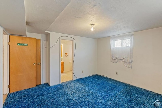 1460 Canyon Dr, South Weber, UT 84405 - unfurnished bedroom with carpet flooring, a textured ceiling, and connected bathroom