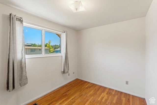 1460 Canyon Dr, South Weber, UT 84405 - unfurnished room featuring wood finished floors and baseboards