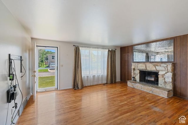 1460 Canyon Dr, South Weber, UT 84405 - unfurnished living room featuring light wood-style flooring, a fireplace, and baseboards