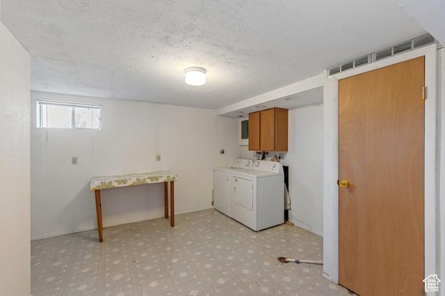 1460 Canyon Dr, South Weber, UT 84405 - laundry room with cabinet space, independent washer and dryer, light floors, and a textured ceiling