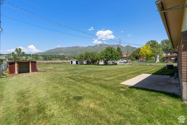 1460 Canyon Dr, South Weber, UT 84405 - view of grassy yard with a mountain view and a patio area