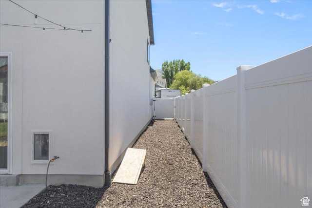 325 W 3170 S, Nibley, UT 84321 - view of side of home featuring a fenced backyard and stucco siding
