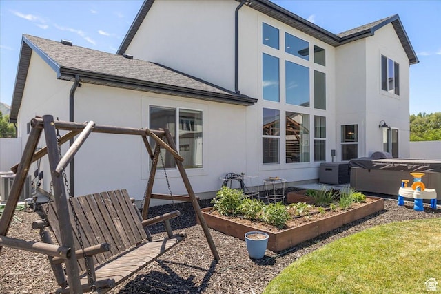 325 W 3170 S, Nibley, UT 84321 - back of house with a vegetable garden, stucco siding, and a shingled roof
