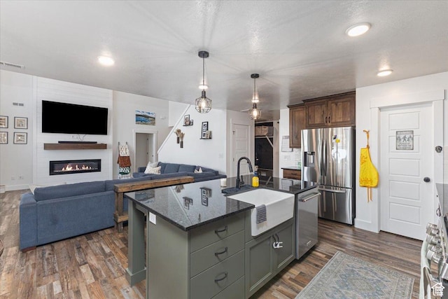 325 W 3170 S, Nibley, UT 84321 - kitchen featuring stainless steel appliances, a sink, dark wood finished floors, and open floor plan