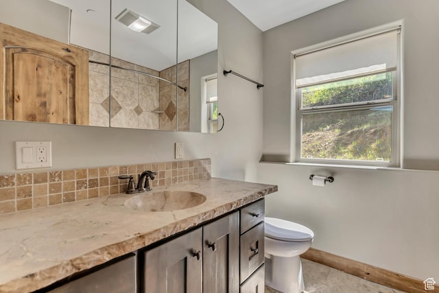 1675 S Beaver Bench Rd E Unit 1417, Heber City, UT 84032 - bathroom featuring a tile shower, vanity, toilet, backsplash, and baseboards