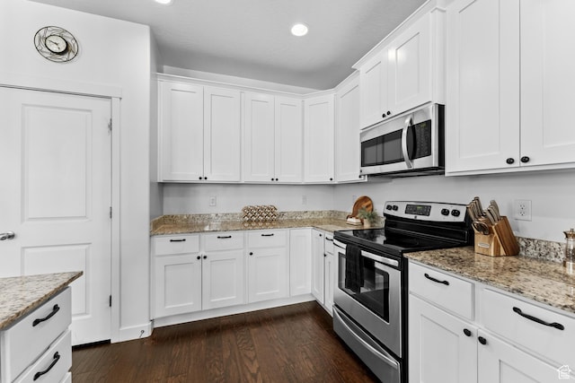 244 E Cordoba Dr, Saratoga Springs, UT 84045 - kitchen with appliances with stainless steel finishes, dark wood finished floors, white cabinetry, light stone countertops, and recessed lighting