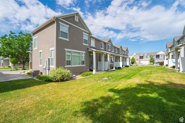 244 E Cordoba Dr, Saratoga Springs, UT 84045 - rear view of property with a residential view, stucco siding, and a lawn