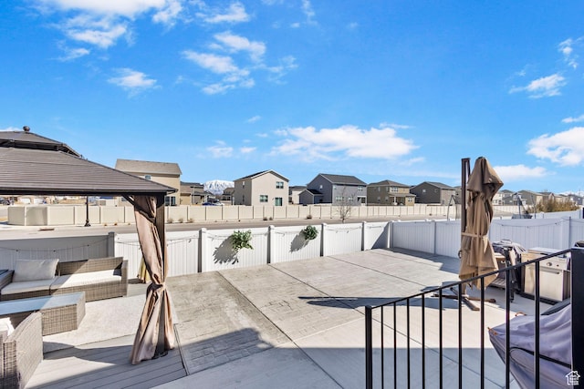 432 N Commodore Ln, Saratoga Springs, UT 84045 - fenced backyard with a residential view, a patio, a gazebo, and a hot tub