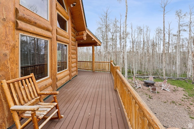 1085 Moose Hollow Rd, Robertson, WY 82944 - wooden deck featuring an outdoor fire pit