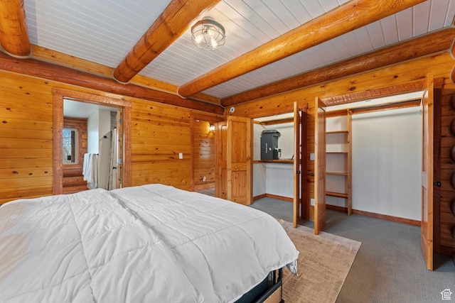 1085 Moose Hollow Rd, Robertson, WY 82944 - carpeted bedroom featuring wood ceiling with exposed beams and baseboards