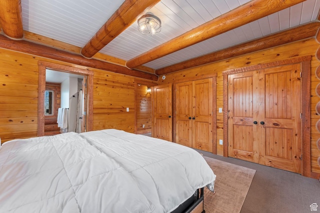 1085 Moose Hollow Rd, Robertson, WY 82944 - carpeted bedroom with wooden walls and wooden ceiling with exposed beams
