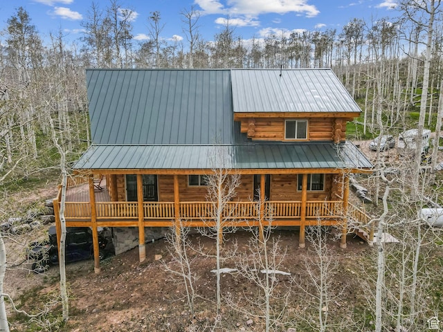 1085 Moose Hollow Rd, Robertson, WY 82944 - rear view of house with log exterior, a porch, and metal roof