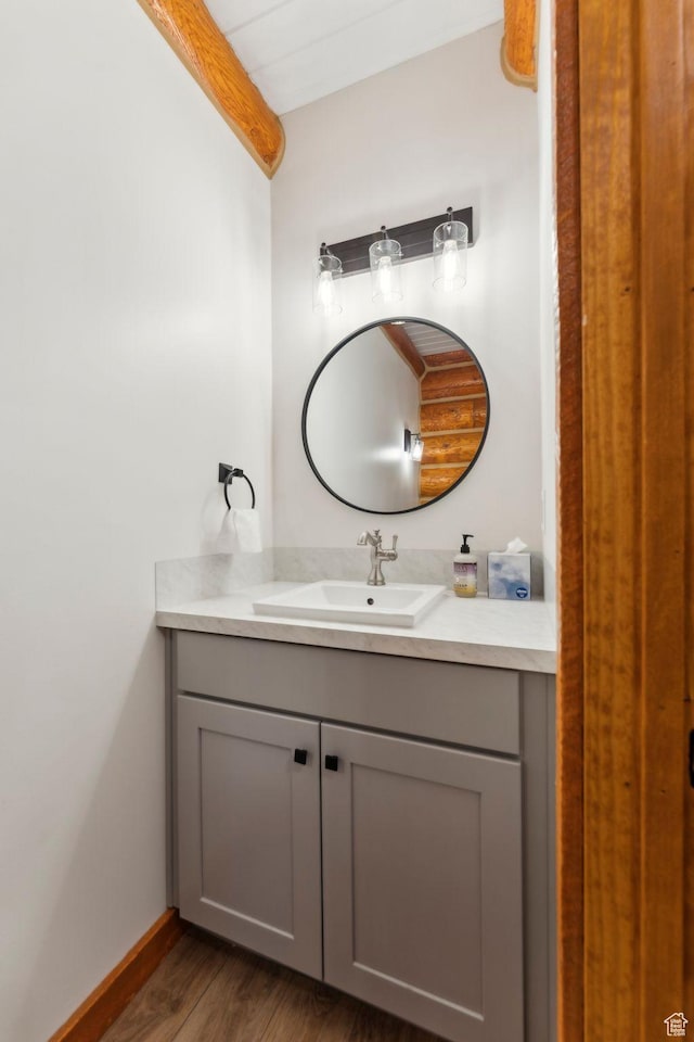 1085 Moose Hollow Rd, Robertson, WY 82944 - bathroom with vanity, wood finished floors, and baseboards