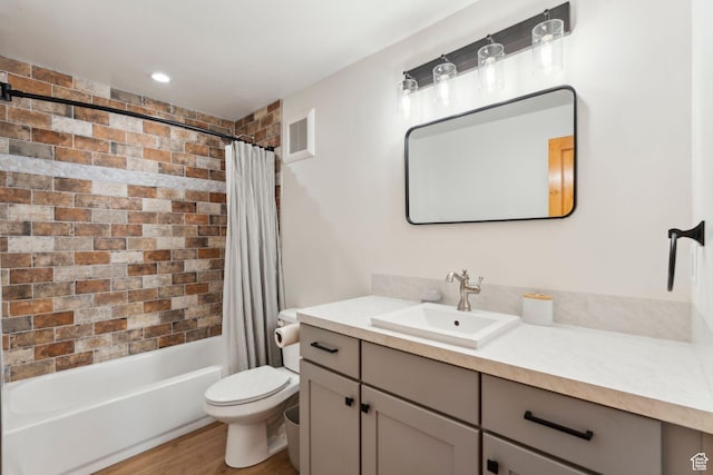 1085 Moose Hollow Rd, Robertson, WY 82944 - full bathroom featuring vanity, toilet, shower / bath combination with curtain, and wood finished floors