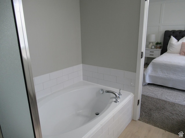 1377 Country Park Dr, Kaysville, UT 84037 - bathroom with a bath, ensuite bathroom, and wood finished floors