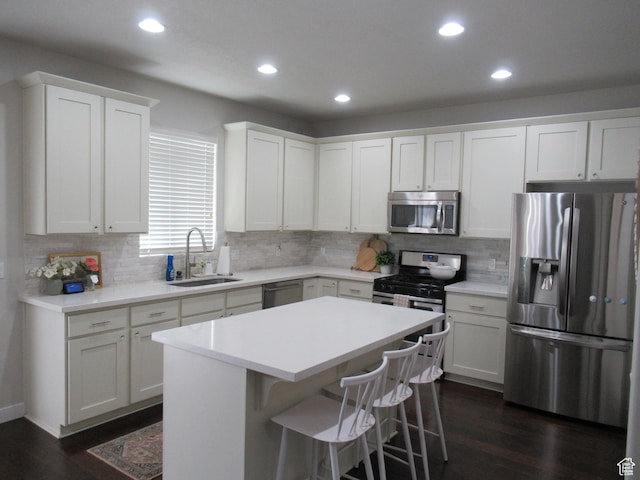 1377 Country Park Dr, Kaysville, UT 84037 - kitchen featuring appliances with stainless steel finishes, a sink, dark wood finished floors, recessed lighting, and decorative backsplash