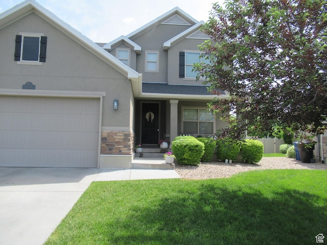 1377 Country Park Dr, Kaysville, UT 84037 - view of front of house with stucco siding, stone siding, driveway, and a garage