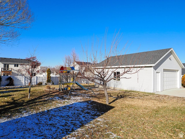 1875 N 270 W, Tooele, UT 84074 - view of yard featuring a playground and a garage