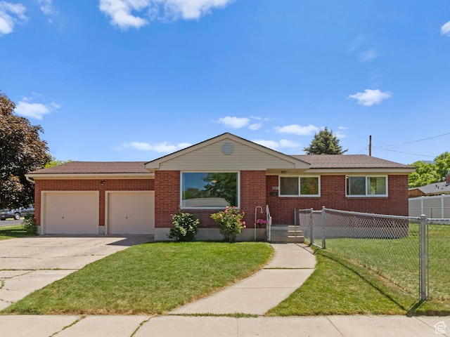 1026 N 500 E, Logan, UT 84341 - single story home featuring a garage, concrete driveway, and brick siding