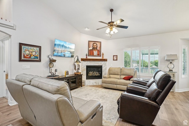 9451 S Peaceful View Way S, Jordan, UT 84095 - living room with ceiling fan, light wood-style flooring, a high end fireplace, lofted ceiling, and baseboards