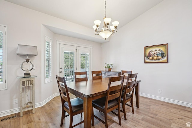 9451 S Peaceful View Way S, Jordan, UT 84095 - dining area featuring a chandelier, light wood-style floors, baseboards, and lofted ceiling