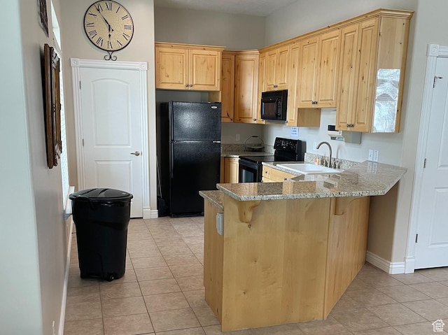 9451 S Peaceful View Way S, Jordan, UT 84095 - kitchen featuring black appliances, a sink, light brown cabinetry, light tile patterned floors, and baseboards