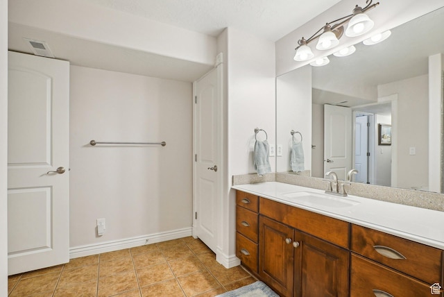 9451 S Peaceful View Way S, Jordan, UT 84095 - bathroom with vanity, tile patterned floors, and baseboards
