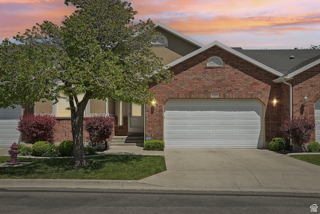 9451 S Peaceful View Way S, Jordan, UT 84095 - view of front of home featuring concrete driveway, brick siding, a garage, and a front lawn
