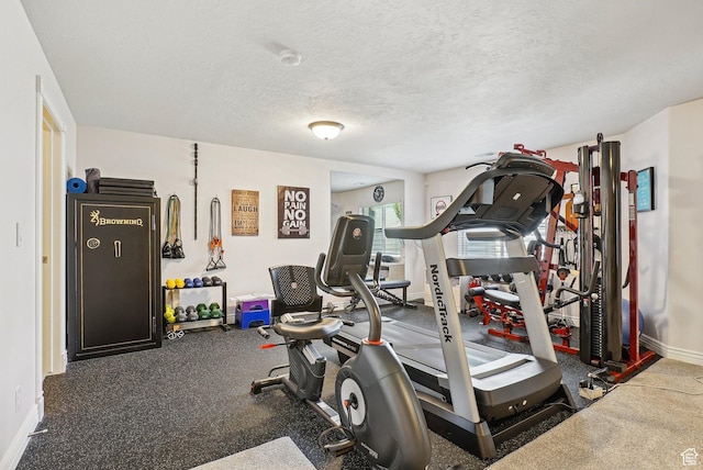 9451 S Peaceful View Way S, Jordan, UT 84095 - exercise room featuring baseboards and a textured ceiling