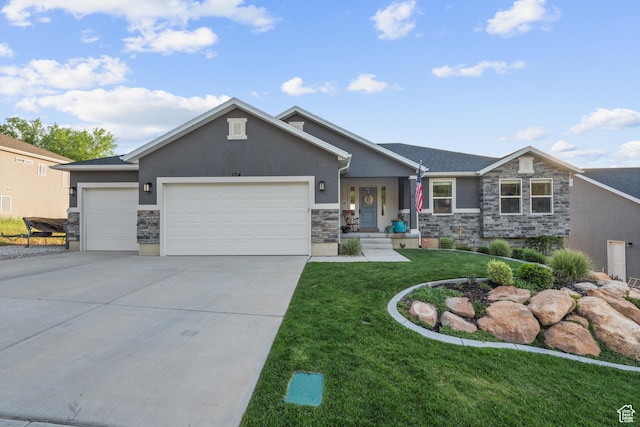 104 S 1250 E, Santaquin, UT 84655 - view of front of property with stucco siding, stone siding, an attached garage, a front yard, and driveway