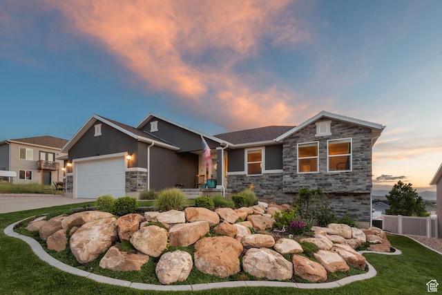 104 S 1250 E, Santaquin, UT 84655 - view of front of home with stone siding, stucco siding, a garage, and concrete driveway