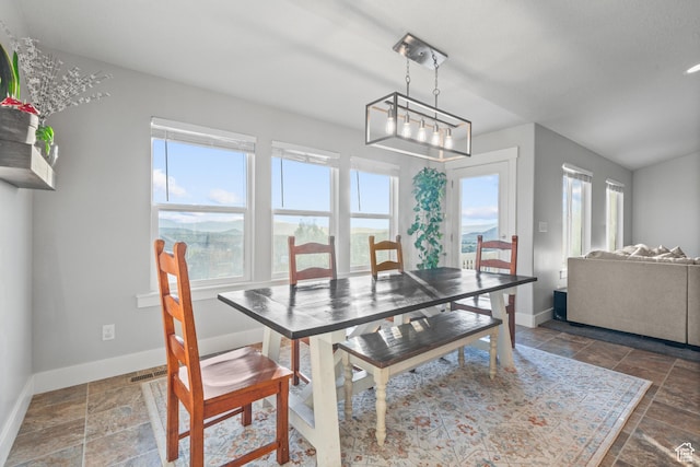 104 S 1250 E, Santaquin, UT 84655 - dining space featuring baseboards, stone finish flooring, and a chandelier
