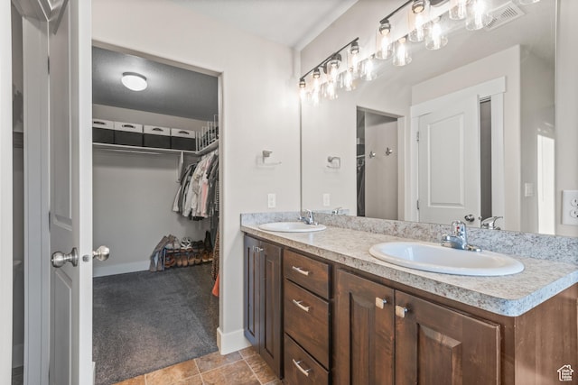104 S 1250 E, Santaquin, UT 84655 - full bath with double vanity, a spacious closet, and baseboards
