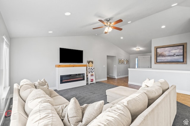 104 S 1250 E, Santaquin, UT 84655 - living room featuring lofted ceiling, baseboards, ceiling fan, recessed lighting, and a glass covered fireplace