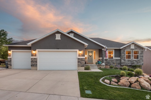 104 S 1250 E, Santaquin, UT 84655 - view of front of home with stone siding, stucco siding, an attached garage, and driveway
