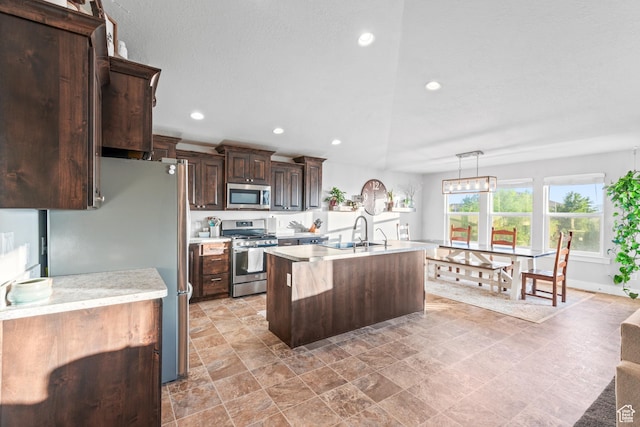 104 S 1250 E, Santaquin, UT 84655 - kitchen featuring stainless steel appliances, light countertops, a sink, dark brown cabinetry, and recessed lighting