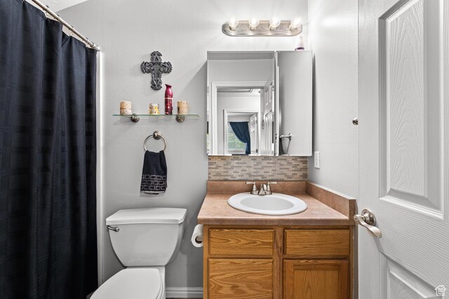 2384 N Nectar Way E, Saratoga Springs, UT 84045 - bathroom featuring decorative backsplash, vanity, toilet, and a shower with curtain