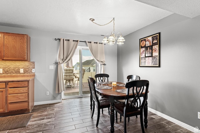 2384 N Nectar Way E, Saratoga Springs, UT 84045 - dining space featuring wood tiled floors, baseboards, a chandelier, and a textured ceiling