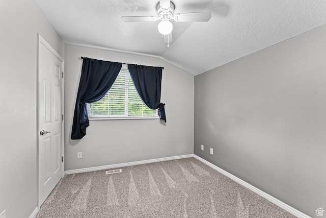 2384 N Nectar Way E, Saratoga Springs, UT 84045 - unfurnished bedroom with a textured ceiling, vaulted ceiling, carpet flooring, baseboards, and a ceiling fan