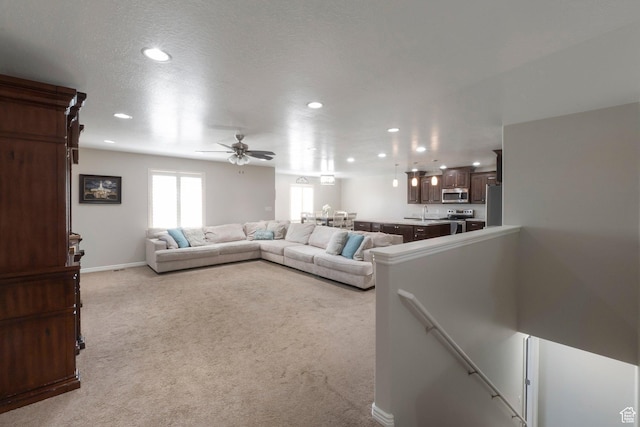491 Travertine Way, Santaquin, UT 84655 - living room featuring light colored carpet, recessed lighting, a ceiling fan, and baseboards
