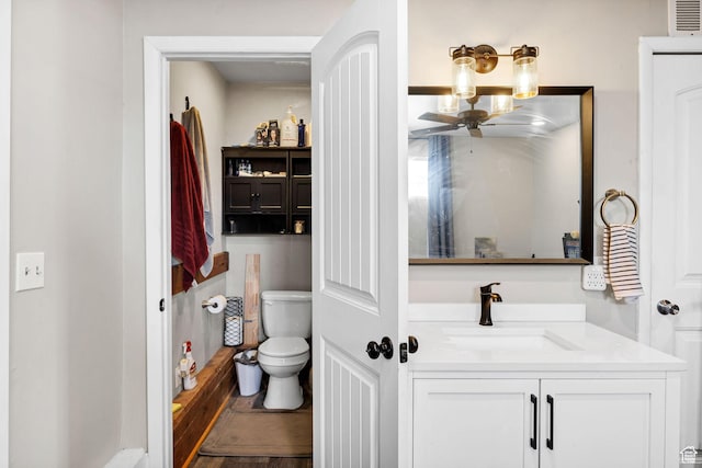 10205 W 10400 N, Tremonton, UT 84337 - bathroom featuring toilet, vanity, and ceiling fan