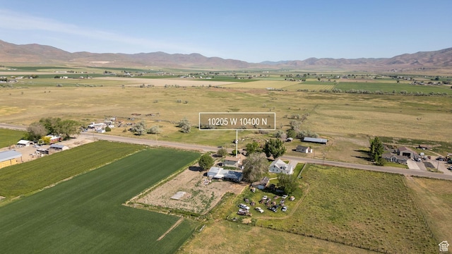 10205 W 10400 N, Tremonton, UT 84337 - aerial overview of property's location with rural landscape and a mountainous background