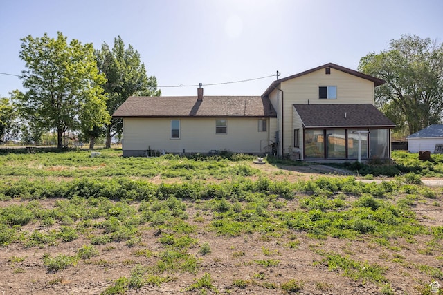 10205 W 10400 N, Tremonton, UT 84337 - rear view of house with a sunroom and a chimney